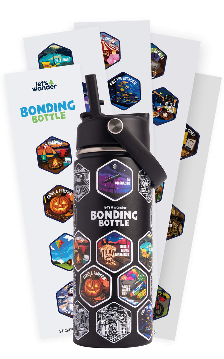 The Bonding Bottle™ by Let's Wander in black with its 28 family activity sticker sheets